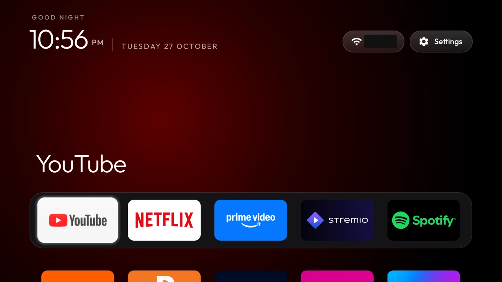 The first CleanYourTV launcher with its clock, red background glow and five-app dock. The Wi-Fi name is redacted.
